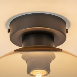 Straluma Mat zwarte plafondlamp met amber glazen bol><noscript><img width=